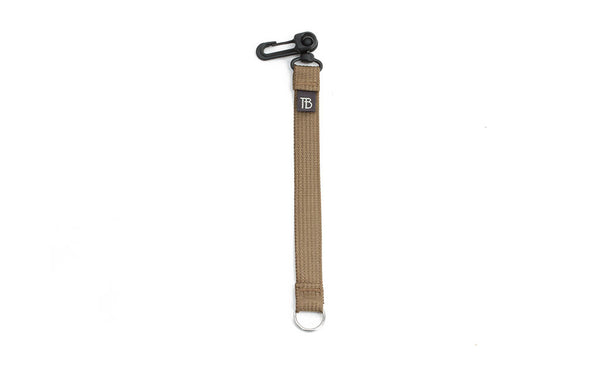 An 8-inch Coyote (tan) Key Strap with a snaphook at one end and a split-ring o-ring at the other.